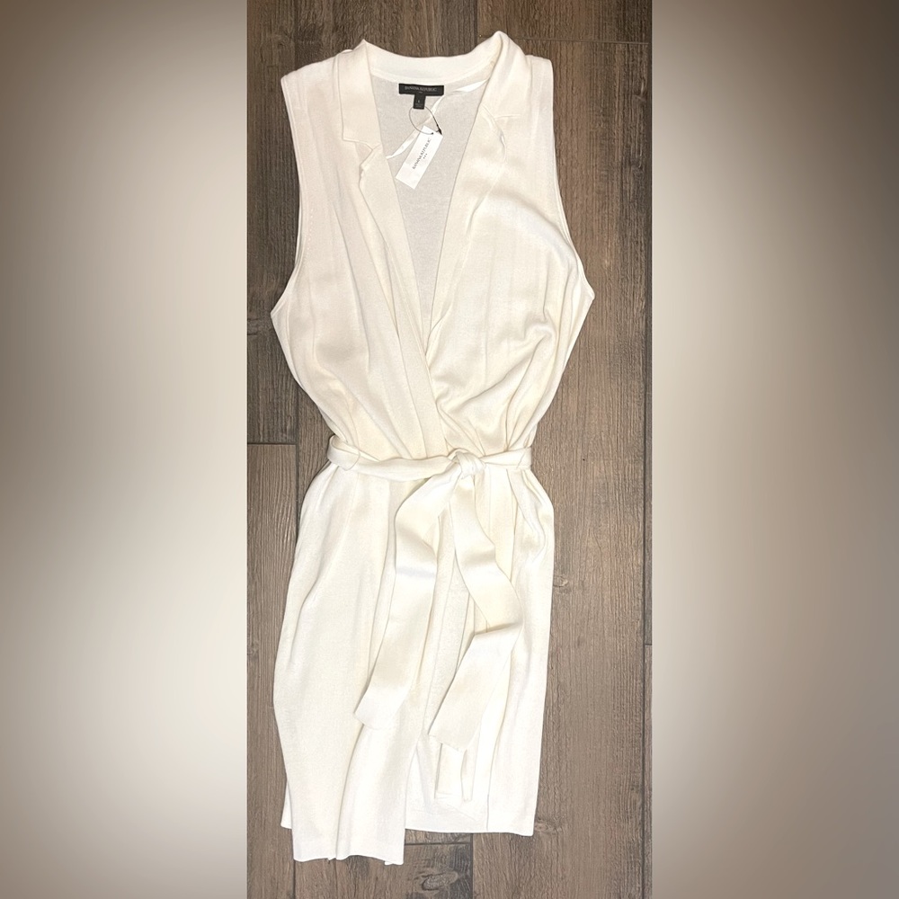 Banana Republic large sleeveless cream colored cardigan with belt.